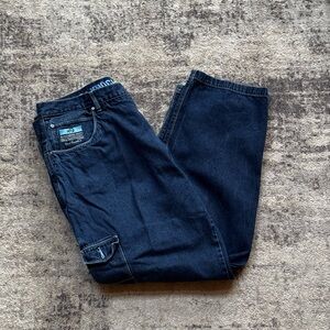 Baggy dark wash blue jeans with a skater vibe